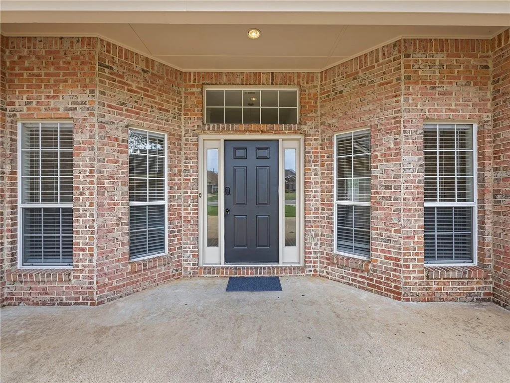 Covered brick front porch and entry door