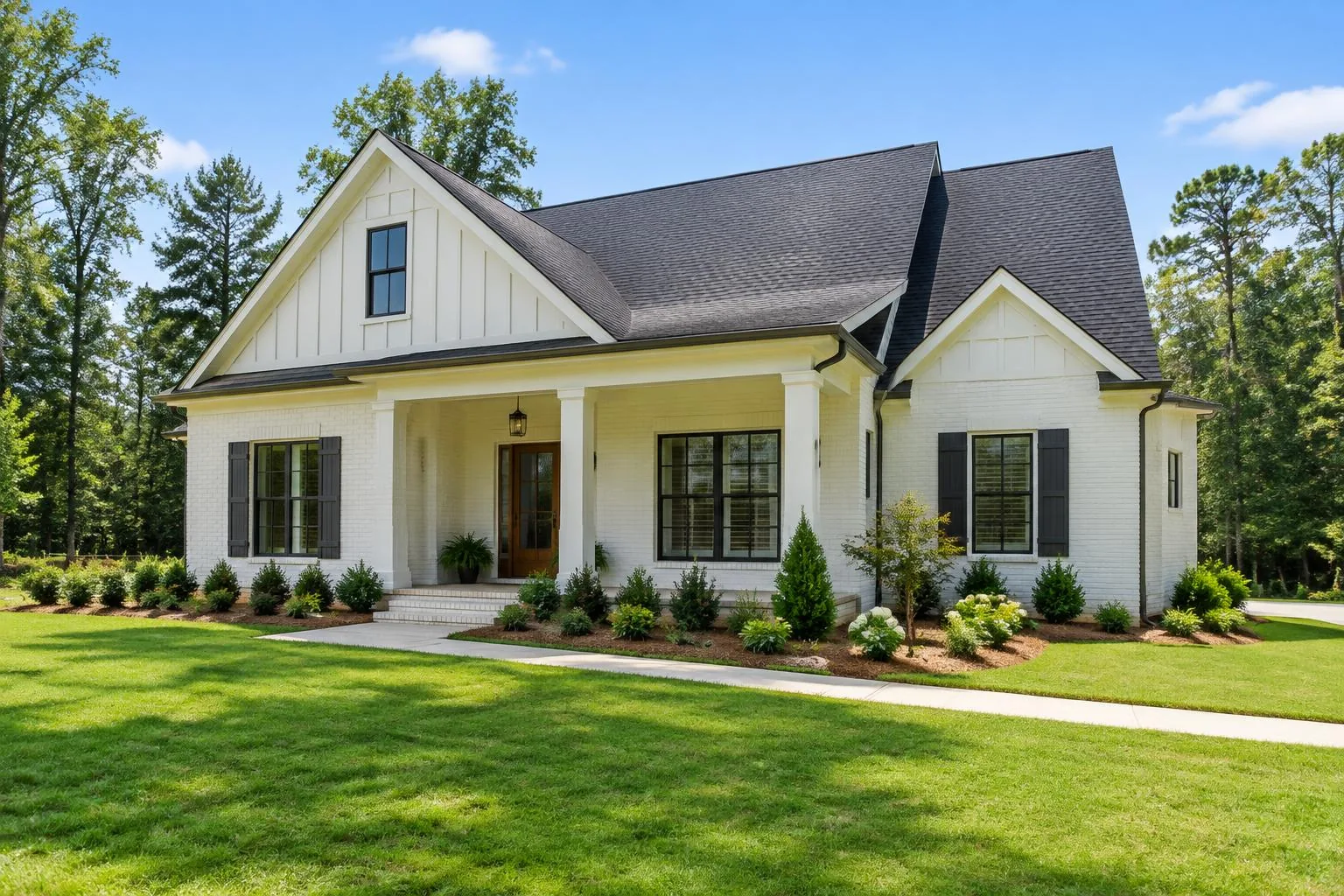 Rendering of a whitewashed brick craftsman home with a covered porch
