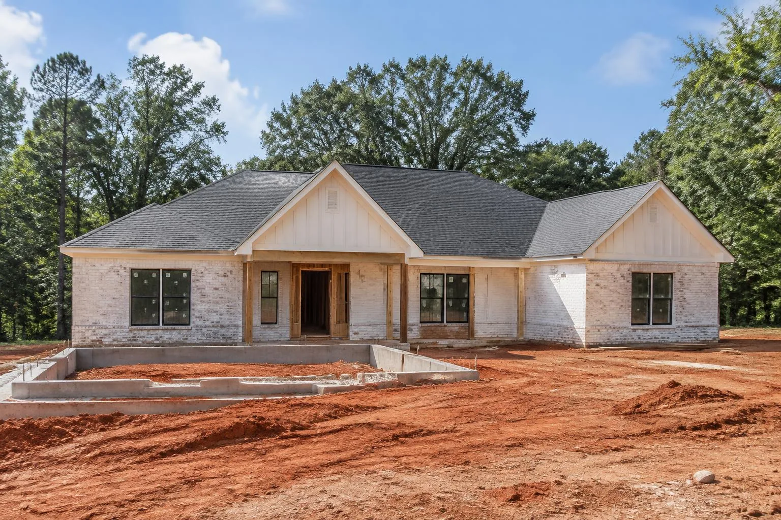Rendering of a Southern home under construction on a clay lot