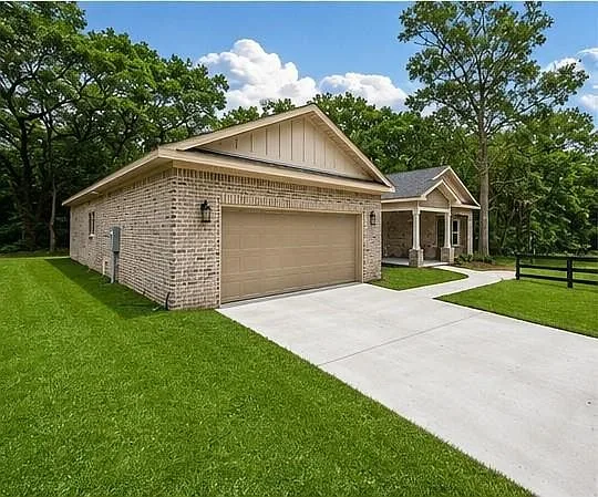Angled view of the brick exterior and driveway