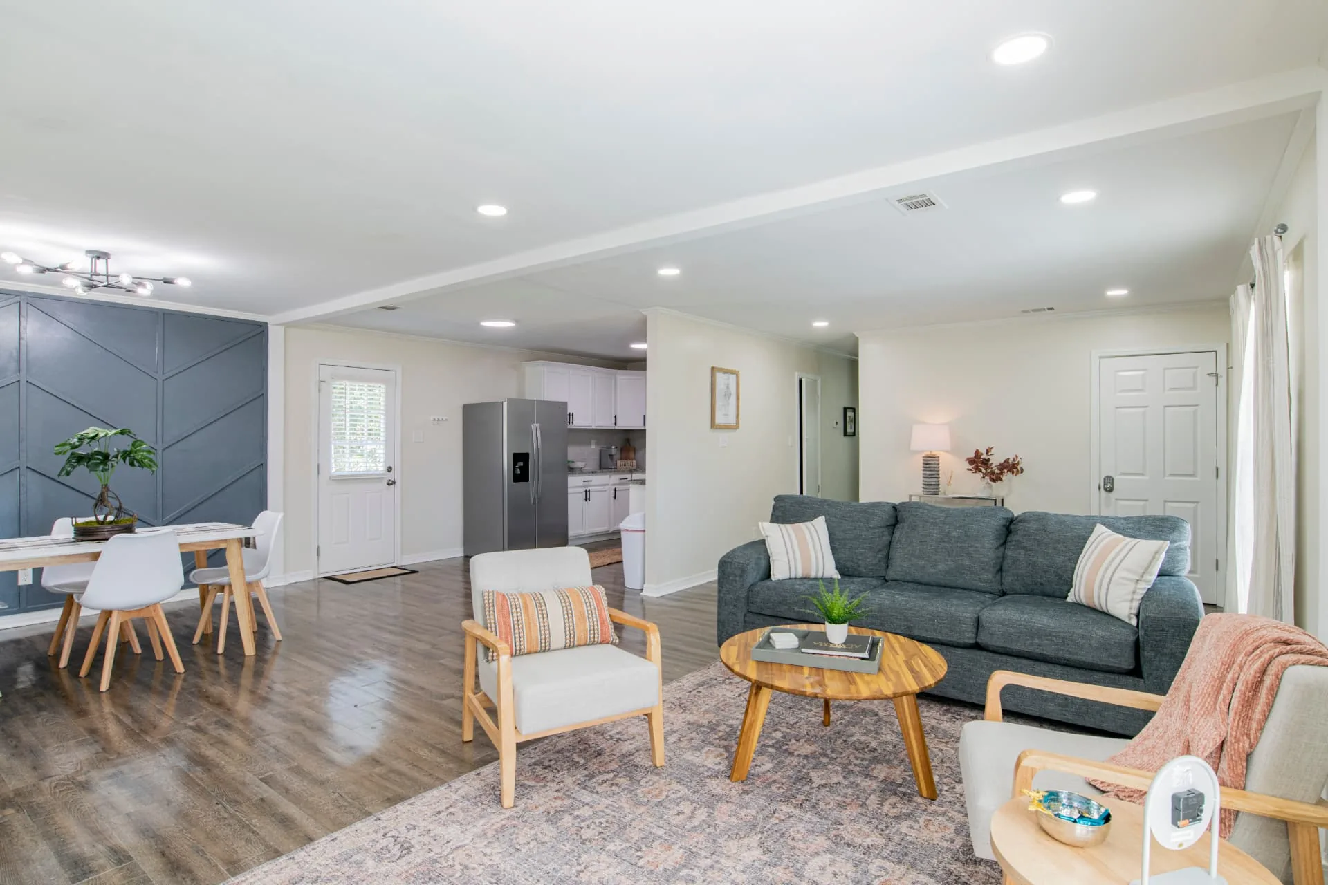 Renovated open living and dining room by Slone Properties
