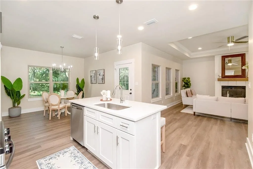 Open kitchen and living area with a white island